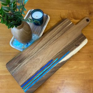 charcuterie board with blue resin inlays