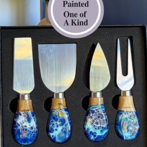 Set of four stainless steel cheese knives with blue and white hand-painted handles in a black box.